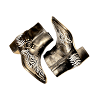 a pair of black boots with zebra print on them